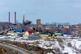 Snowy industrial town with factory smokestacks — hypnotherapy case study of a man who reclaimed the parts of himself he had left behind