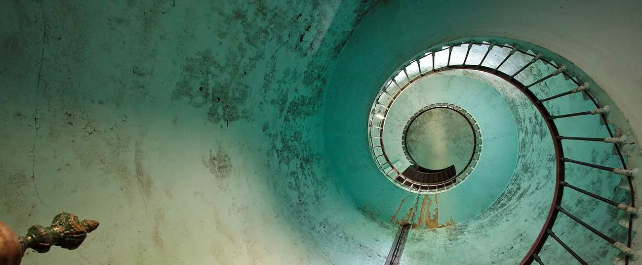 Spiral lighthouse staircase ascending — the path of change
